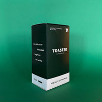 Toasted Coffee Pods Angle View Green Background