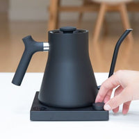 Fellow Stagg EKG Black view with hand on temperature control